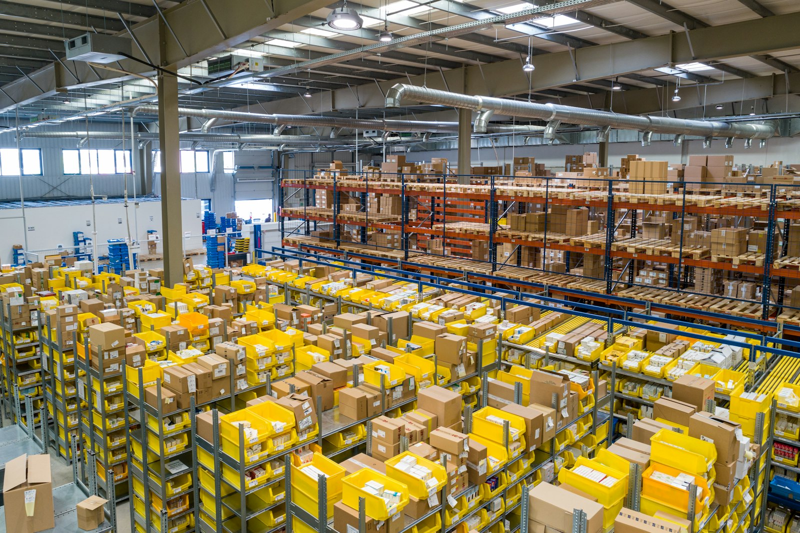 Organized in-house warehouse with material inventory and storage racks